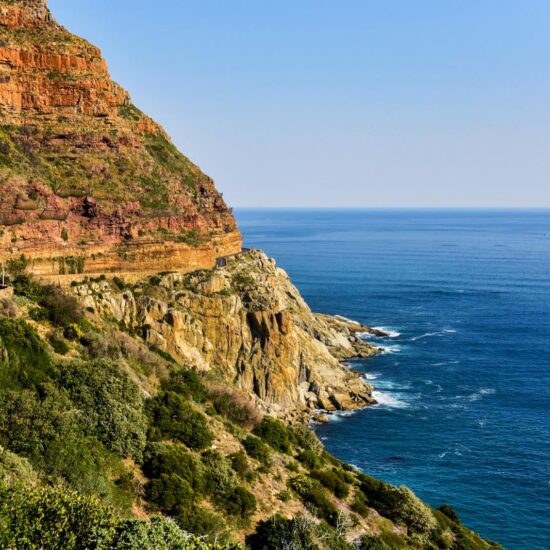 Beautiful coastal cliffs and ocean view in South Africa, showcasing nature's vibrant hues.