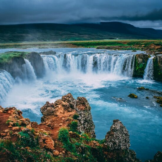 Discover the breathtaking beauty of Godafoss waterfall cascading in Iceland's stunning landscape.